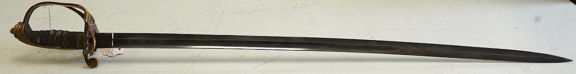 An 1845 infantry officer’s sword, with engraved, fullered and proofed blade, brass guard and remains of shagreen grip, blade 80.5cm. Condition - fair, well worn